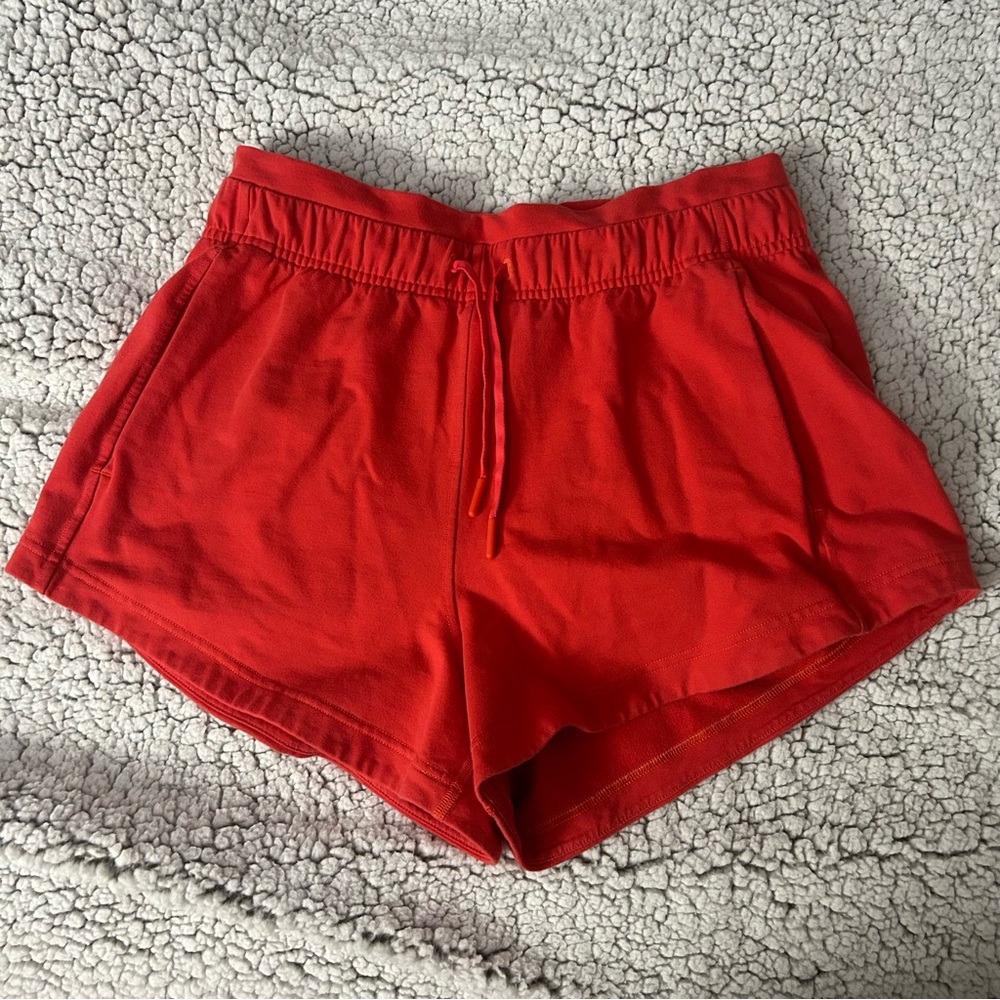 red lululemon drawstring shorts